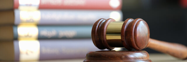 A contractor being convicted in a courtroom for hiring a criminal defense attorney without federal contracting experience